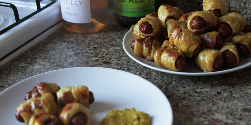 Pretzel wrapped pigs-in-a-blanket with delicious beer.