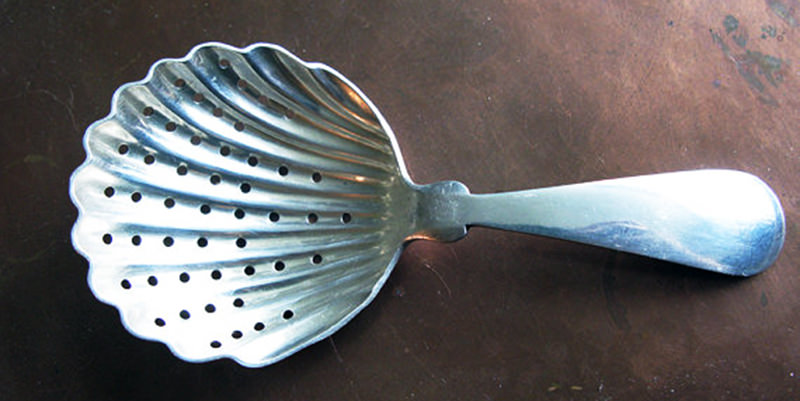 This is a clamshell julep strainer