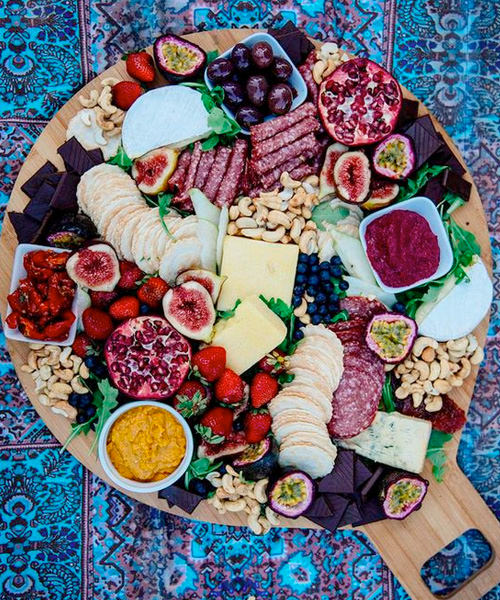 We're Obsessed With These 15 Swoon-Worthy Cheese & Charcuterie Boards Dark Chocolate Cheese Board Spread Pomegranate Figs Dried Fruit Cashews