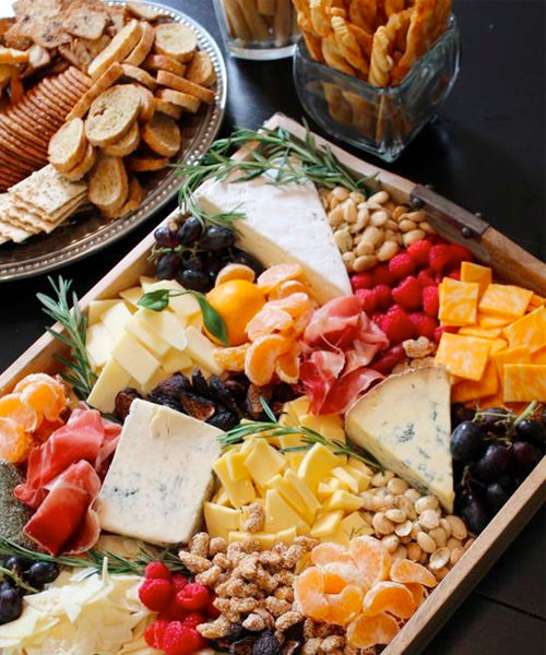 We're Obsessed With These 15 Swoon-Worthy Cheese & Charcuterie Boards Berries and Breadsticks nuts cheese charcuterie crackers board