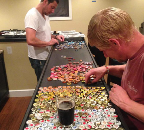 Laying our the bottle caps for the bottle cap bar