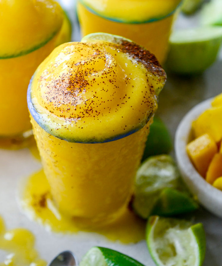 This tequila based Mango Margarita frosty cocktail is a spring drink you need to make right now.