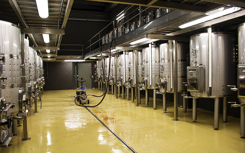 A far smaller 'experimental winery' is adjacent to the room housing the main fermentation tanks