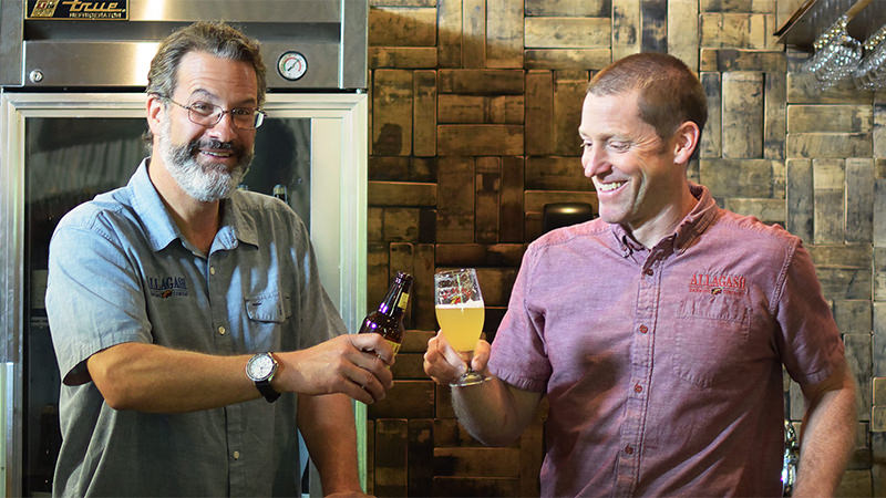 allagash founder rob tod and brewmaster jason perkins cheers allagash white