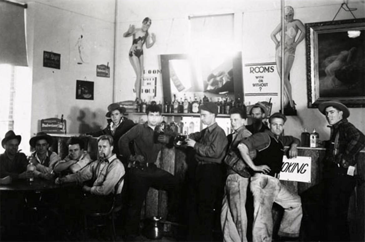 Men (and pictured women) strike a pose at this Old Western tavern in Missoula, Montana.