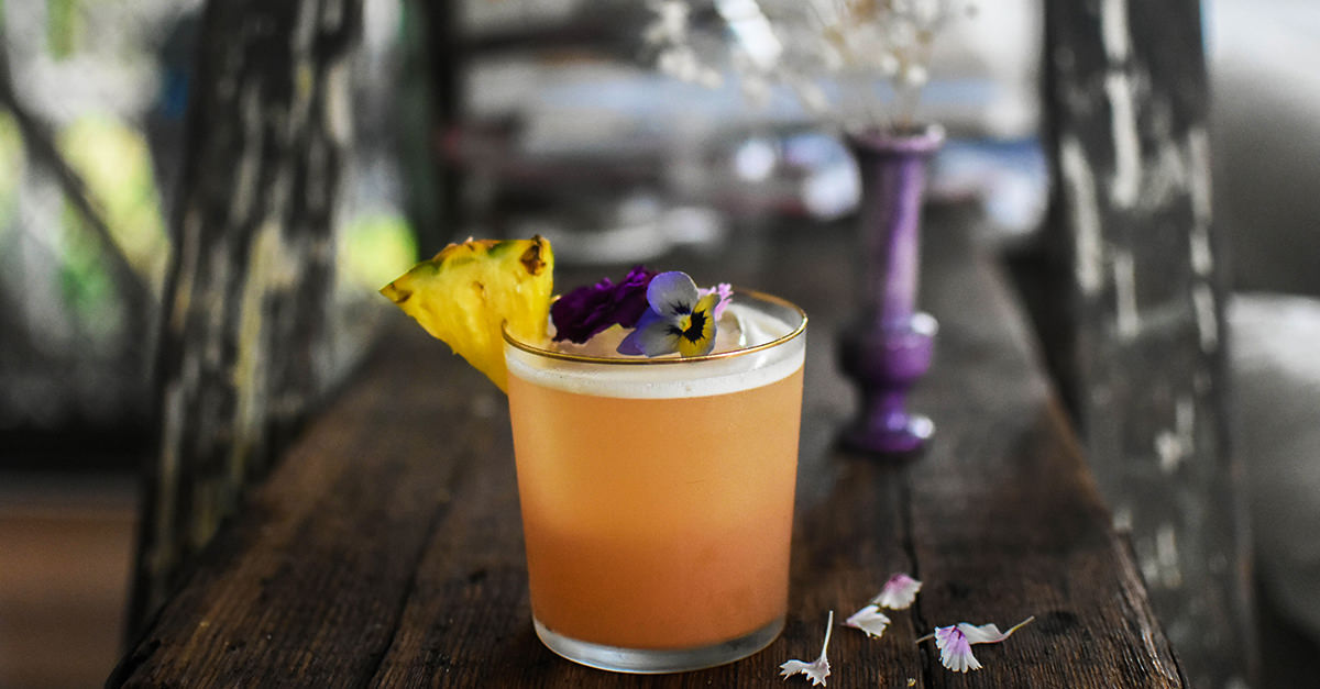 In this impossibly elegant take on the classic Paloma, cherry heering and fresh lime and pineapple juice complement tequila blanco.