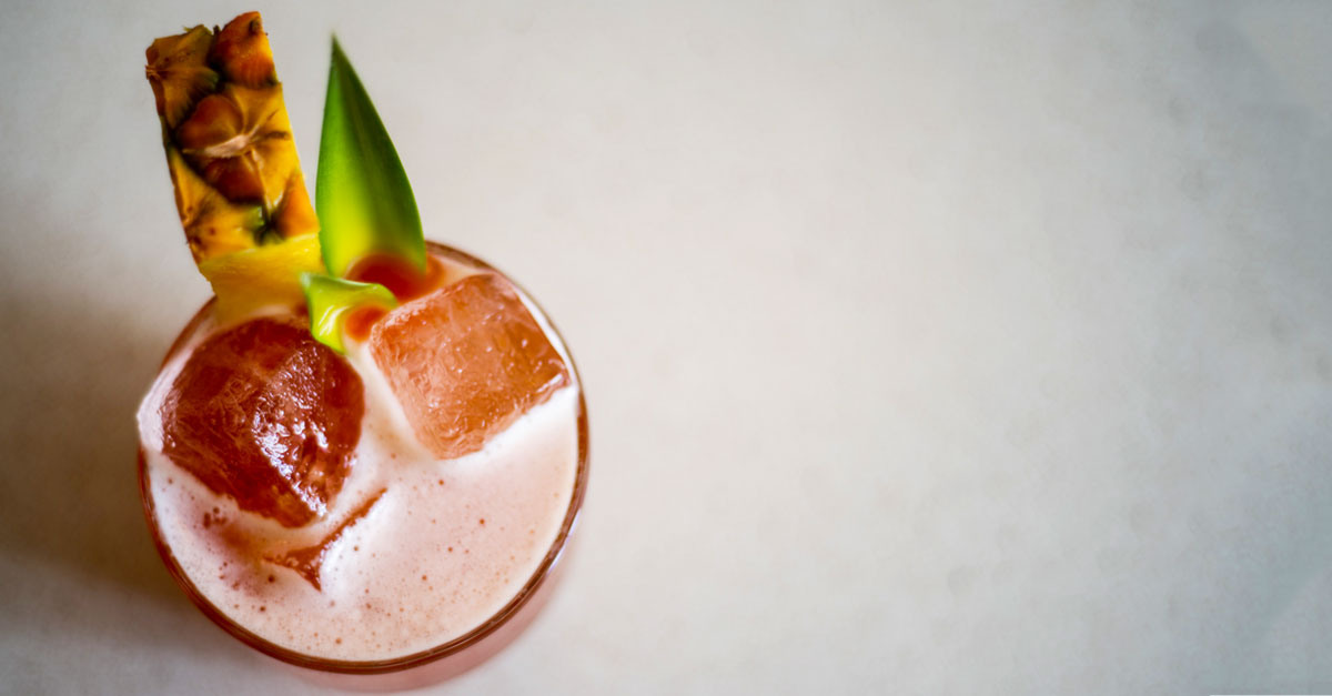 This refreshing cocktail mixes sweet, tart, and savory with pineapple and lime juices, blackstrap rum, mezcal, Campari, and simple syrup. Get the recipe for this summer rum cocktail here.