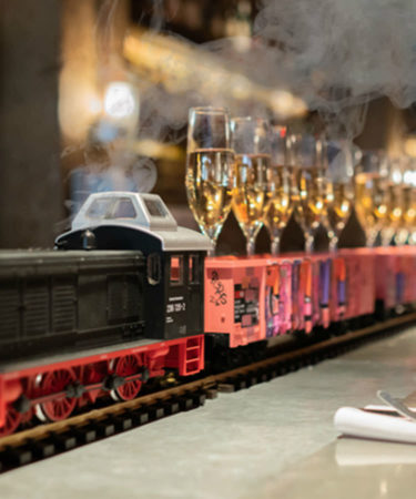 This Restaurant Is Serving Up Bottomless Champagne Delivered by Model Train