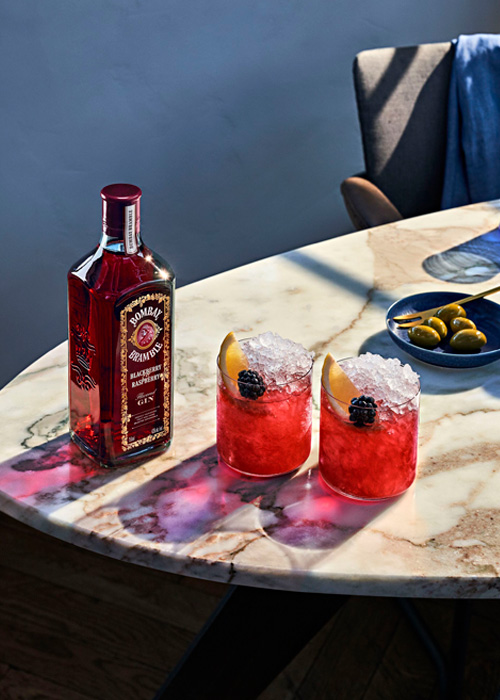 A cocktail made with an invigorating berry gin like Bombay Bramble can bring out the best of the fruit-forward flavors on your plate.