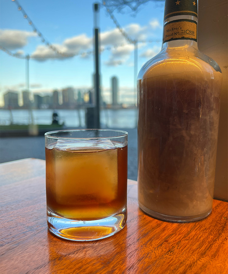 Beeswax-infused bourbon is used to create the Busy Bees at the recently reopened Riverpark in Manhattan.