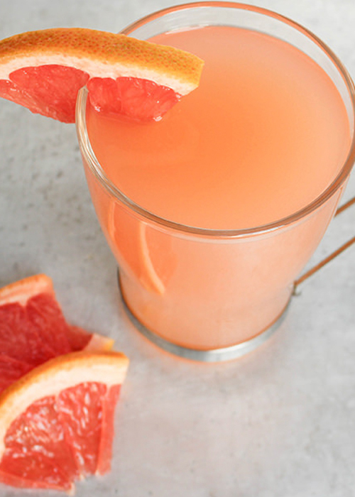 Instead of lemon, a squeeze of grapefruit is added to this tipple— mingling with the botanicals of gin and sweetness of honey for an herbal sipper with a kick.
