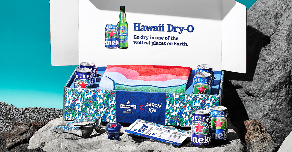 The limited-run packs also include themed sunglasses, a water bottle, bluetooth headphones, and a towel emblazoned with one of Kai’s renditions of a wave breaking over an island volcano.