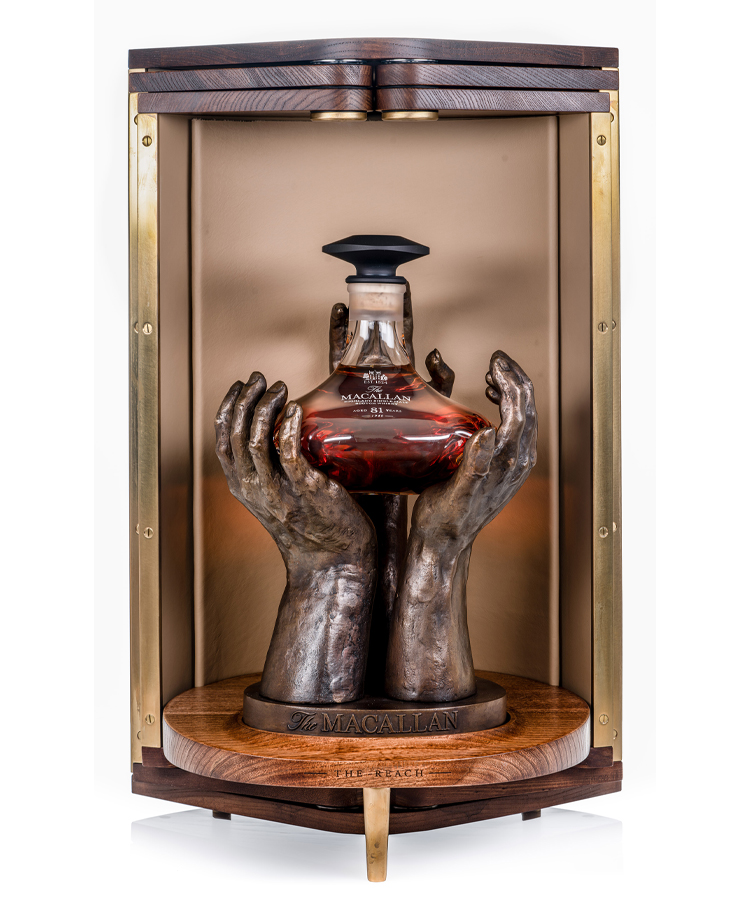 This rare whisky is packaged in a decanter made from mouth-blown glass, perched on a bronze sculpture of three bronze hands that was created by Scottish sculptor Saskia Robinson.