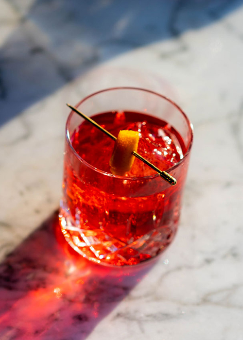 Better than a box of chocolates, this drink is a riff on a Negroni and an Old Pal.