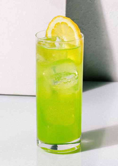 the midori sour is an eye catching shade of green, due to the melon liqueur in it