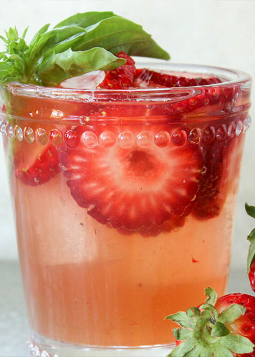 The Strawberry Basil Mule adds strawberries and basil for a fruity and refreshing twist in this mule variation.