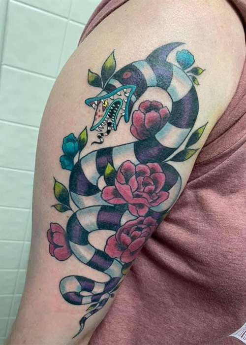 Drink and Ink: Exploring the Connection Between Bartenders and Tattoos, Pictured Here: Lydia Salamon's sandworm from "Beetlejuice."