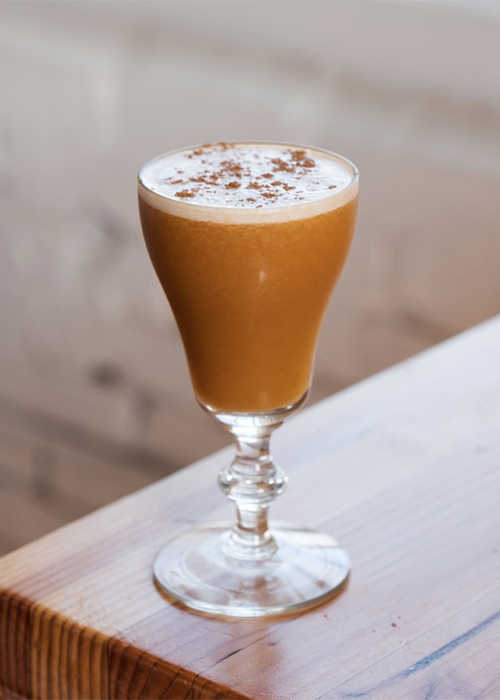 The Pumpkin Spice Flip is a boozy Halloween cocktail to try this fall.