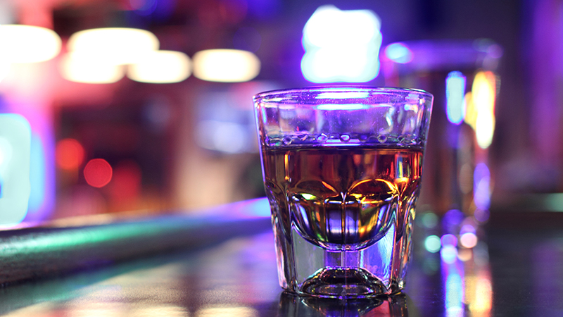 A shot of whiskey is a dive bar staple.