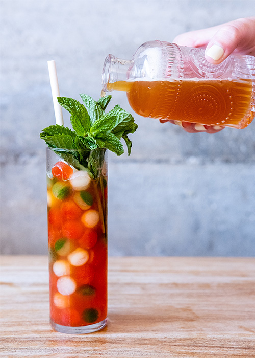 Causwells' Pimm's Cup comes served in a flute filled with marble-sized ice made from the pulp of strawberries and cucumbers that are juiced for the drink.