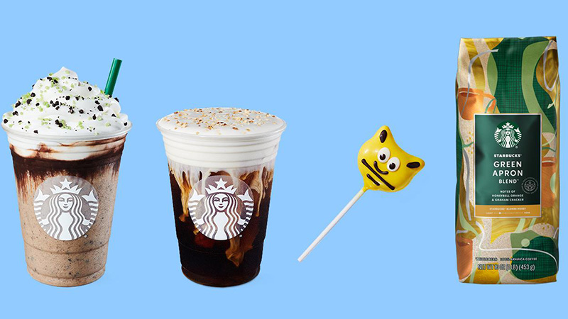 Two Starbucks drinks are pictured with a cake pop and bag of coffee beans