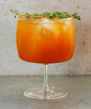 The Thyme-Infused Pumpkin Treat is one of the best cocktails for Thanksgiving. 
