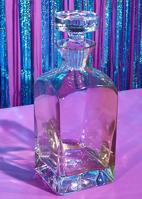 The Estelle Colored Glass Decanter in Heritage (Iridescent) is one of the best gifts you can give this holiday season. 