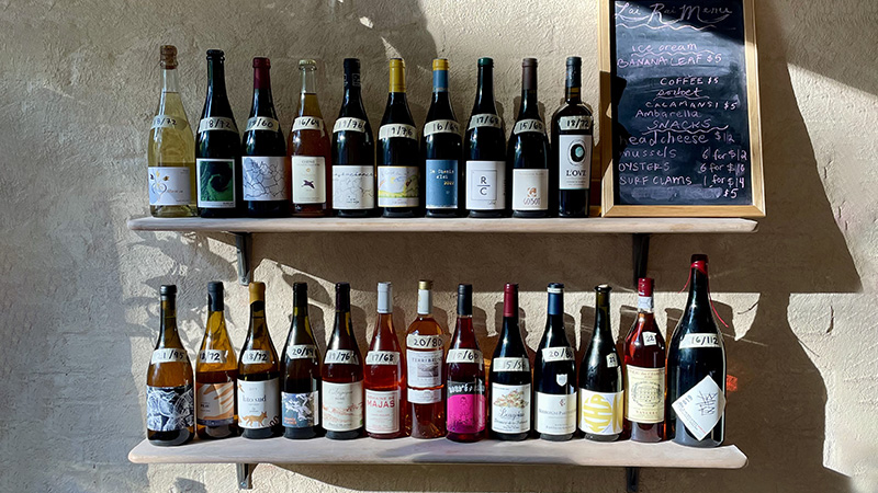 At Lai Rai, printed wine lists have been ditched in favor of bottle displays. 