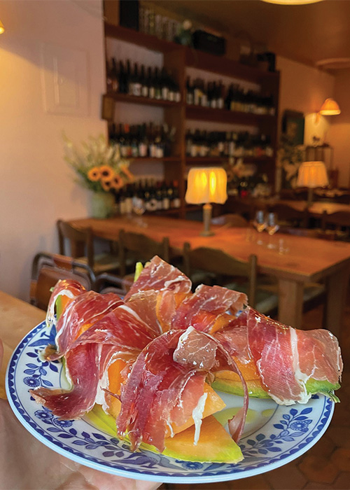 Prosciutto-draped cantaloupe is one of the best wine bar small plates. Check out the rest of the ranking here. 