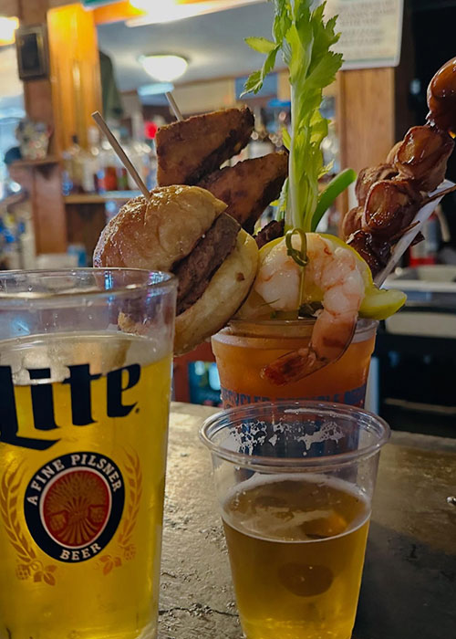 A cheeseburger is a garnish for Bloody Marys.