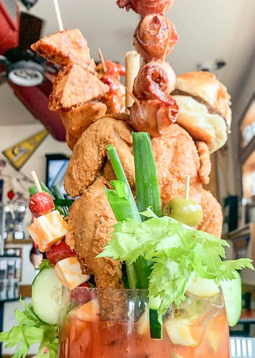 Fried chicken is a garnish for Bloody Marys.