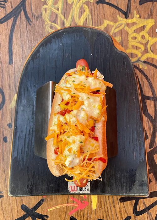 The Perro Con Todo at Santa Salsa is one of the best bar hot dogs in NYC.