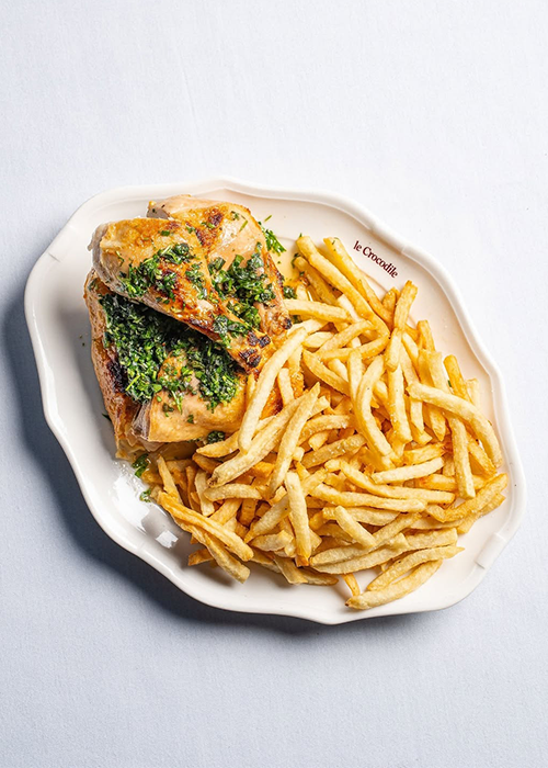 At Le Crocodile, pair the roast chicken with a Spritz.